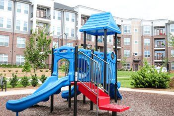 Tot lot with outdoor playground